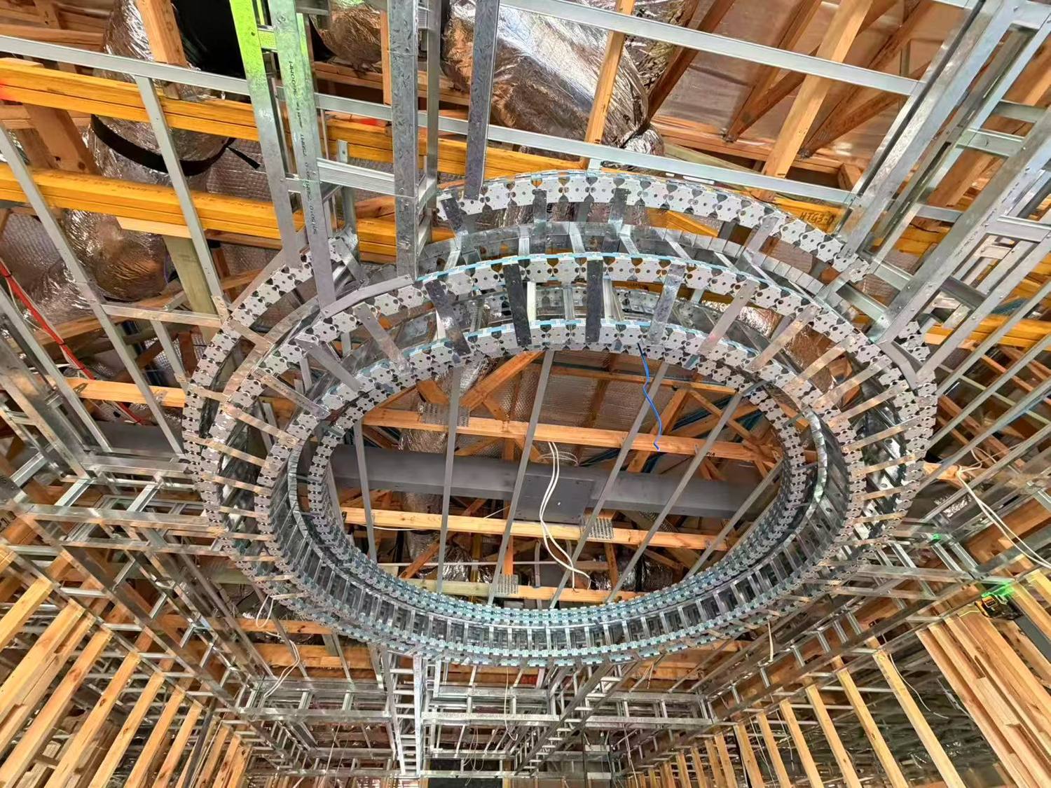 Steel ceiling framing with a curved oval bulkhead under construction