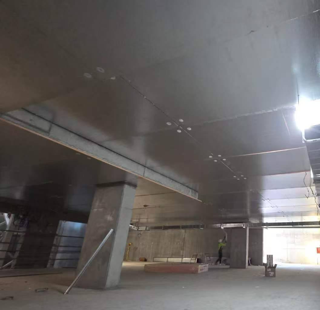 Basement carpark soffit lined with insulation panels